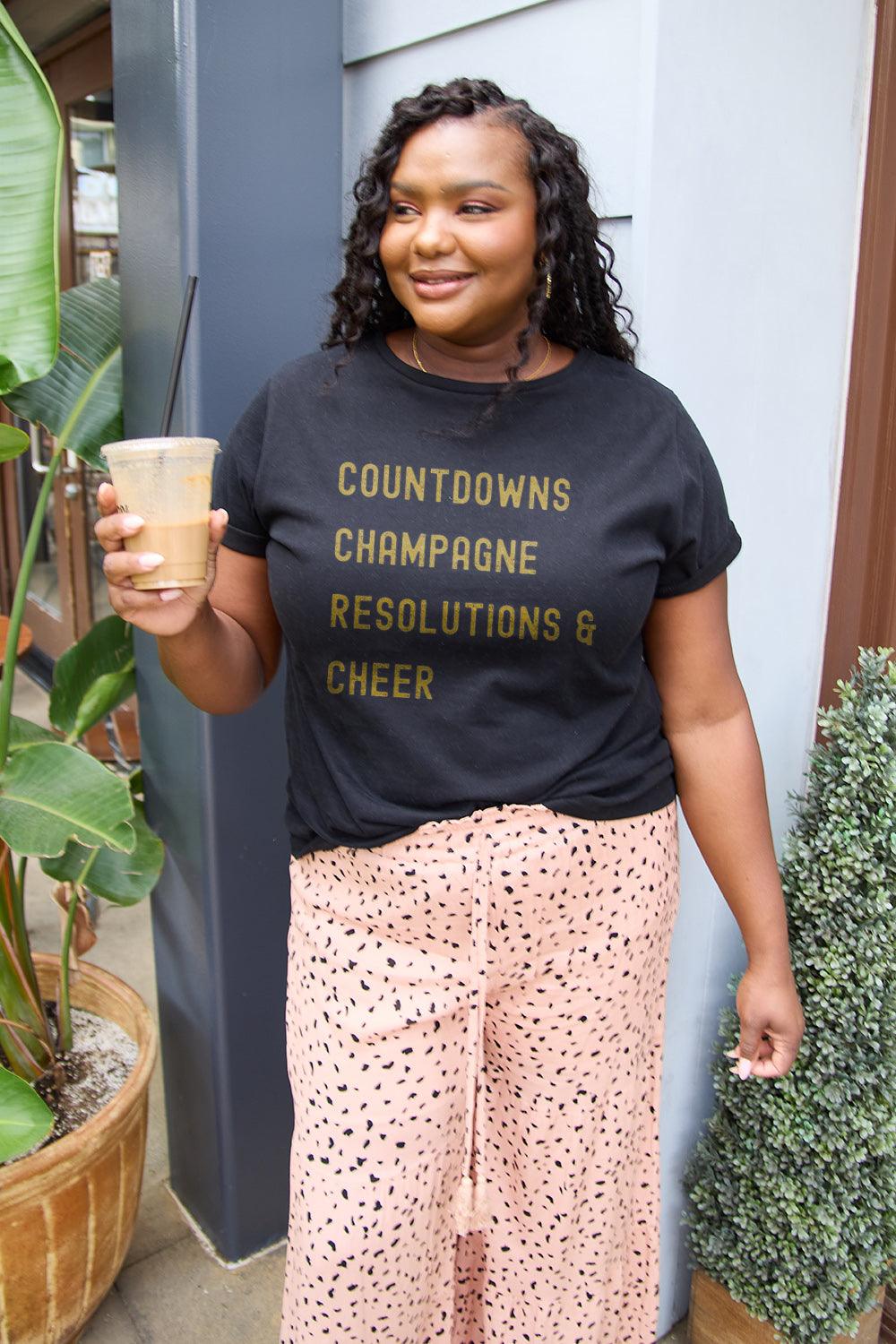 Simply Love Full Size COUNTDOWNS CHAMPAGNE RESOLUTIONS & CHEER Round Neck T-Shirt Carauana Store