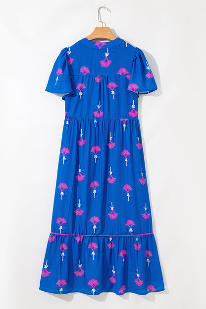 Blue dress with pink floral pattern on a white background