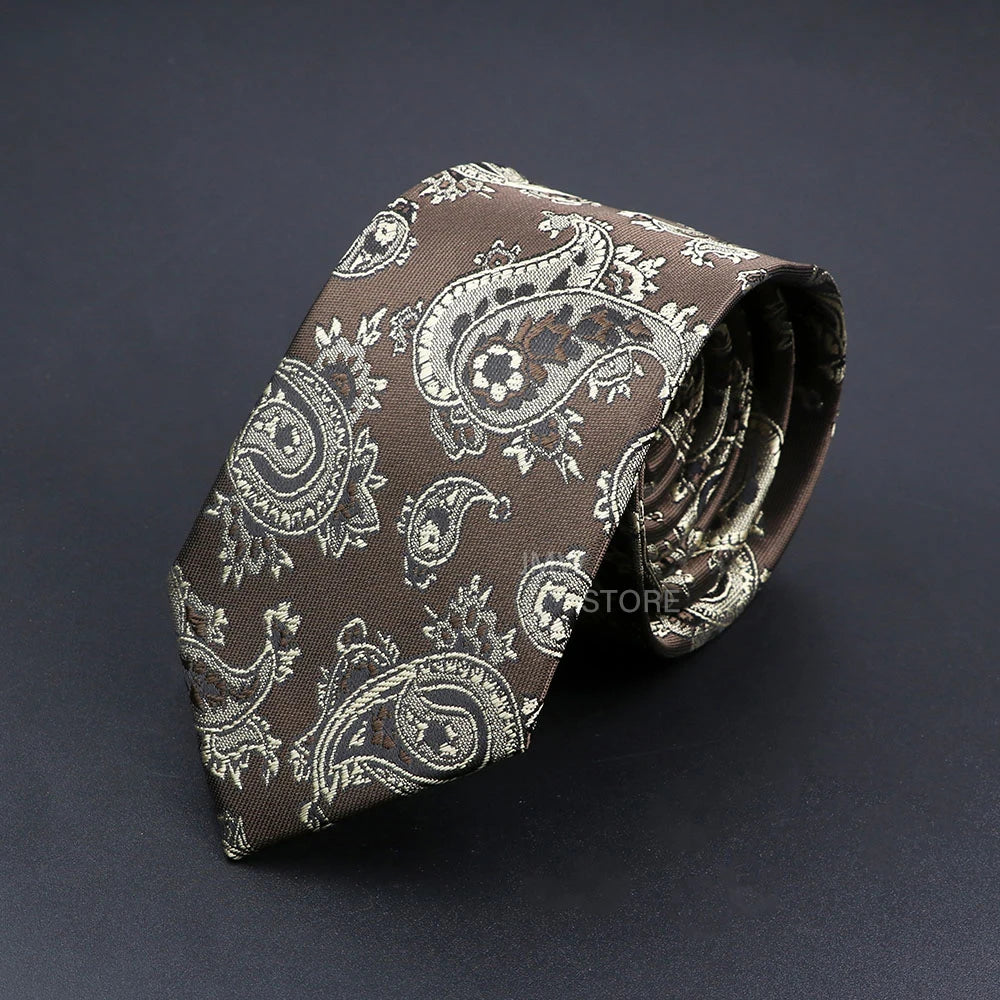 Brown paisley patterned tie on a dark background
