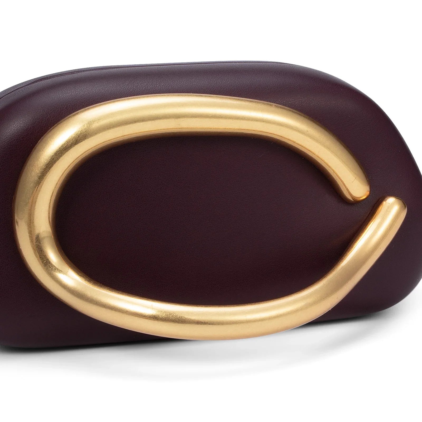 Purple clutch with a gold handle on a white background