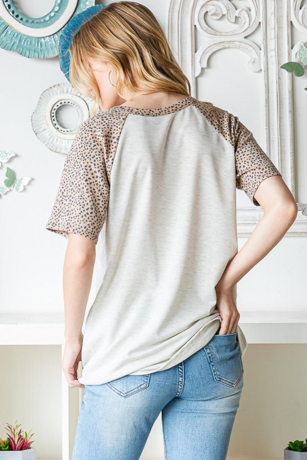 Heimish Full Size Animal Print Half Button Short Sleeve Top Carauana Store