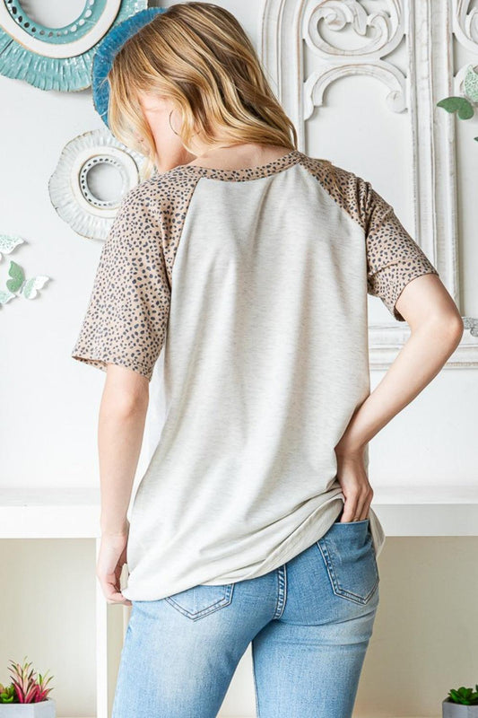 Heimish Full Size Animal Print Half Button Short Sleeve Top Carauana Store