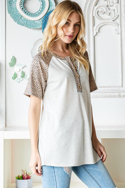 Heimish Full Size Animal Print Half Button Short Sleeve Top Carauana Store