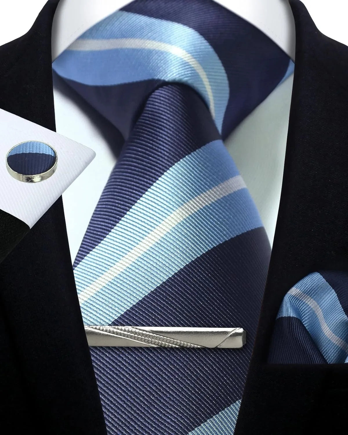 Navy and light blue striped tie with matching pocket square and tie clip on a white shirt.