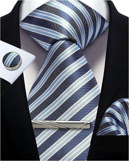 Blue and white striped tie with matching pocket square and cufflinks on a black suit.