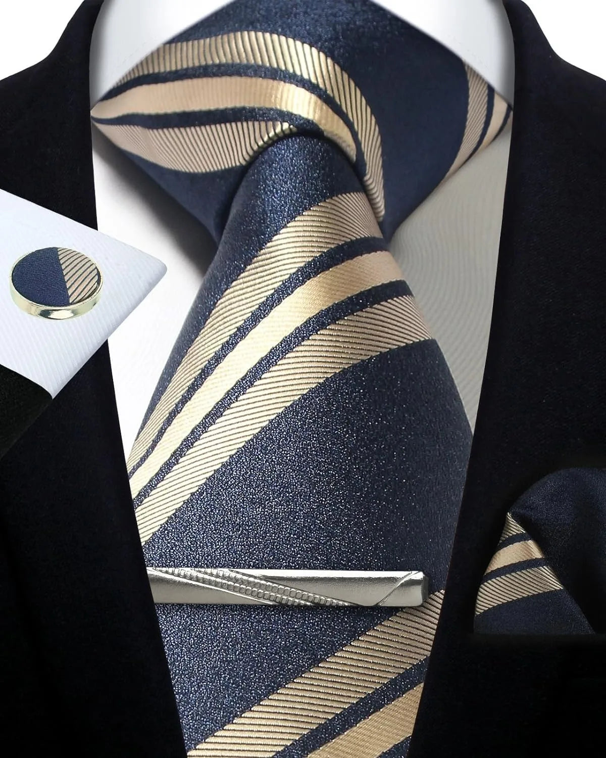 Navy and beige striped tie with matching pocket square and cufflinks on a black suit.