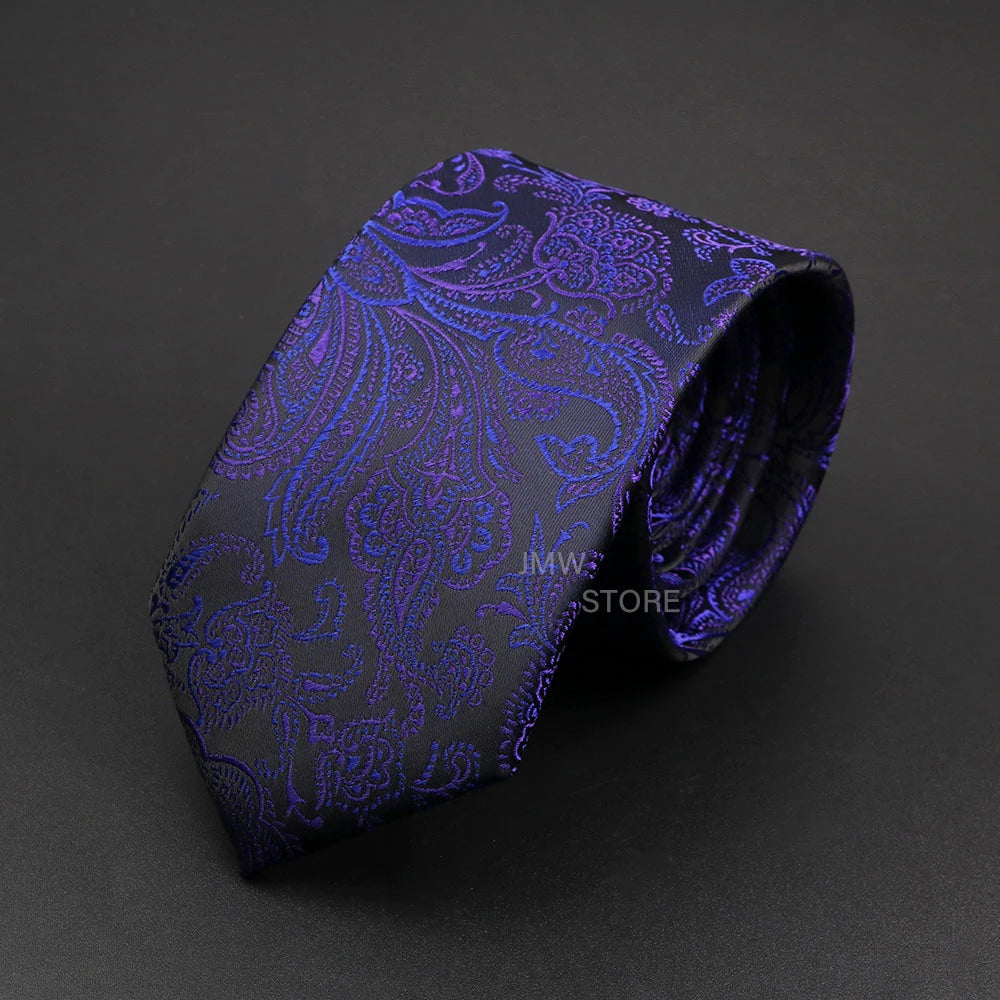 Purple paisley patterned tie on a dark gray background