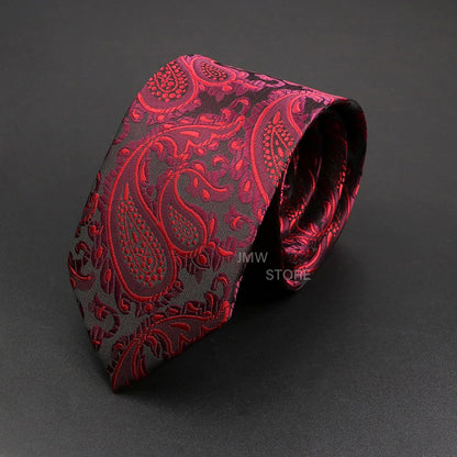 Red paisley patterned tie on a dark gray background